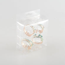 Charger l'image dans la galerie, Lot de 4 ronds de serviettes dorés avec diamants verts
